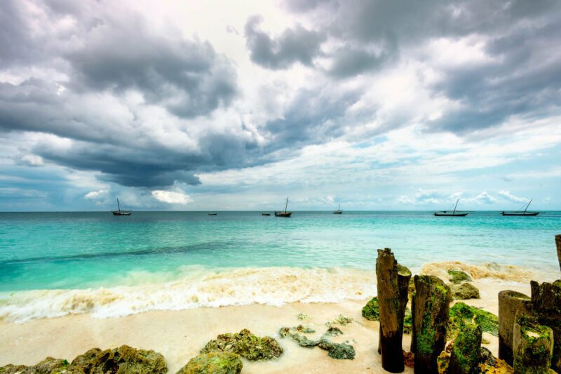 Safe On The Beach, Nungwi, Zanzibar – traditional dhows anchored beneath an approaching storm