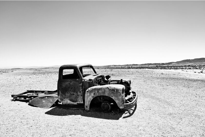 No Name, No Road – Ai-Ais, Namibia. Black and white photograph of an abandoned vintage pickup standing alone in the desert near Ai-Ais and Fish River Canyon in Namibia